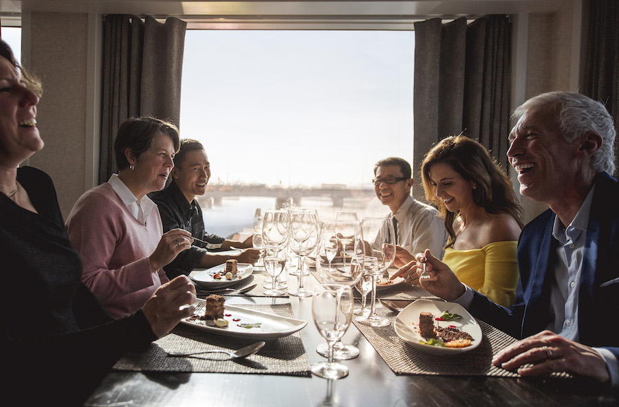 Guests eating dinner on an Adventure by Disney vacation