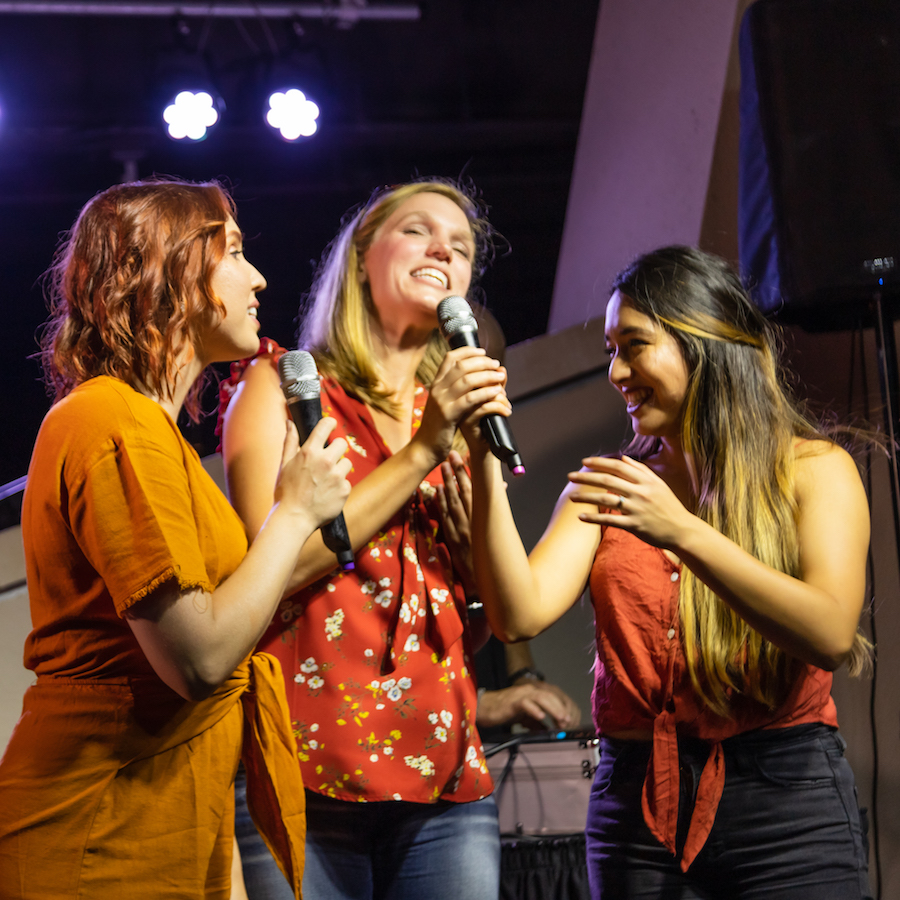 Friends enjoying Karaoke Night at Stargazers Bar at Planet Hollywood