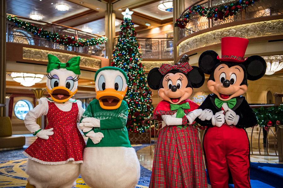 Donald and Daisy and Mickey and Minnie in holiday attire aboard Disney Cruise Line