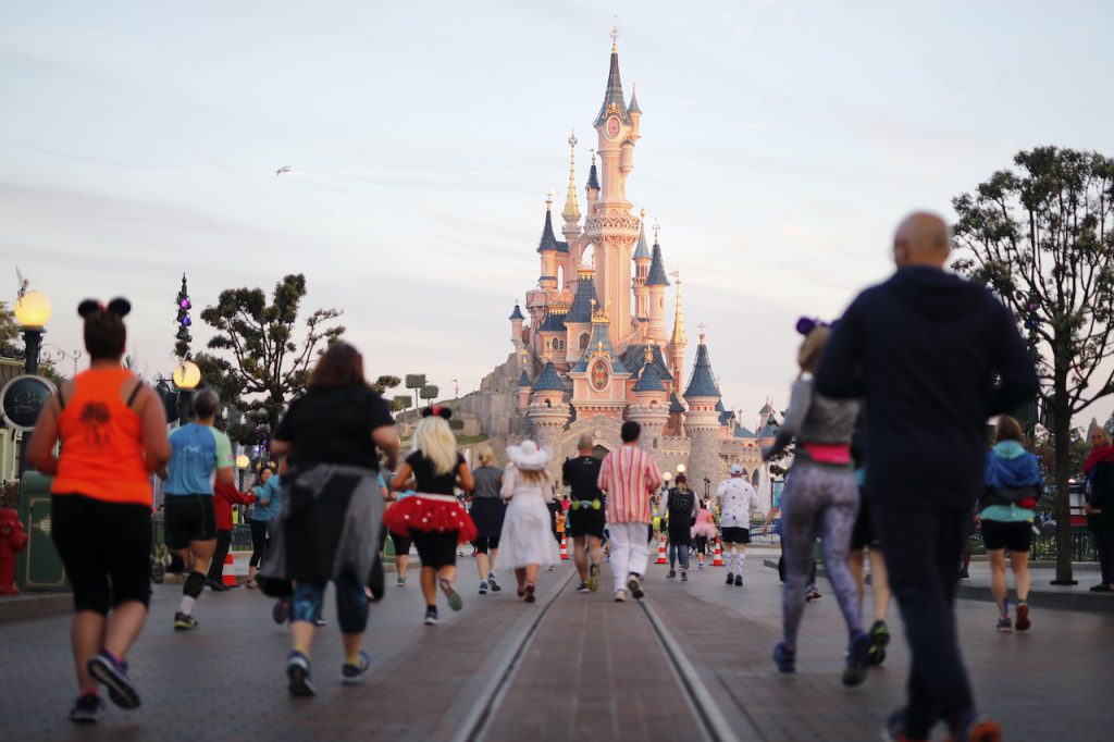 Guests running at Disneyland Paris