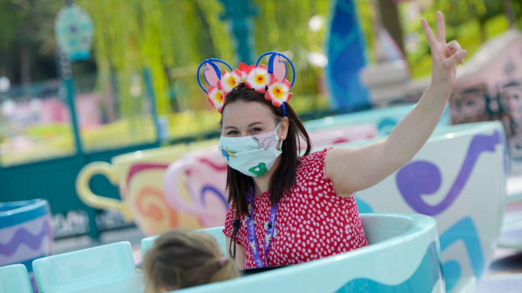 Guests ride the Mad Hatter's Tea Cups at Disneyland Paris