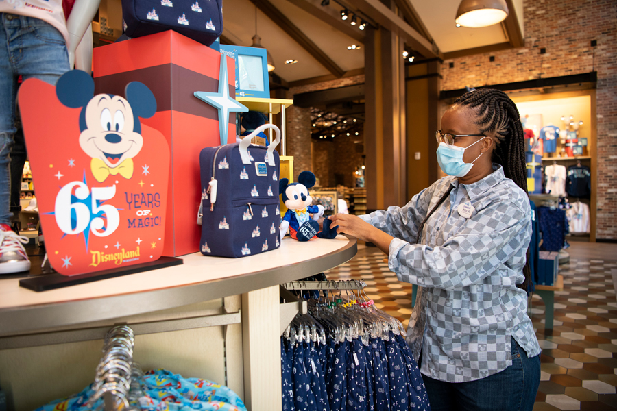 Cast member in World of Disney store in the Downtown Disney District at Disneyland Resort