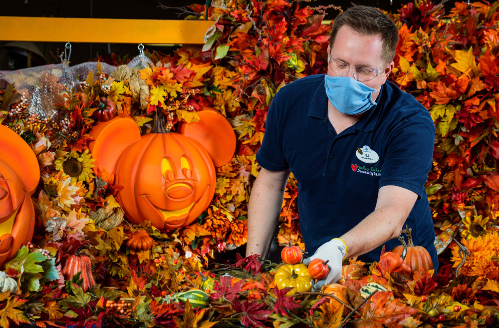 Cast member making fall decor