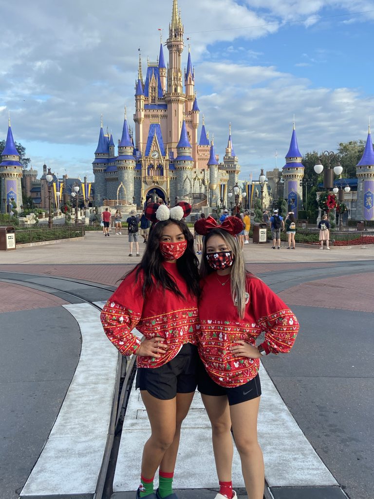 Guests in holiday outfits at Magic Kingdom Park