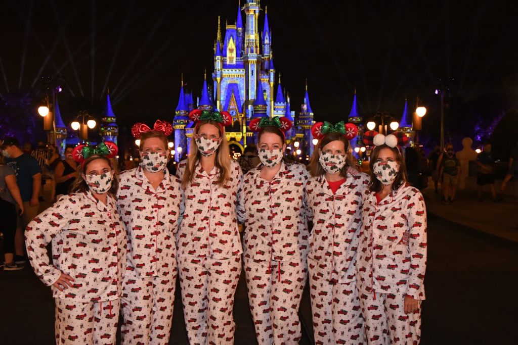 Guests in Christmas Pjs at Magic Kingdom Park