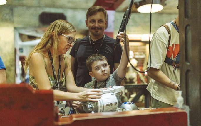 A family builds a droid inside Star Wars: Galaxy's Edge 