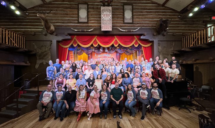 Hoop-Dee-Doo cast members pose together in front of the stage