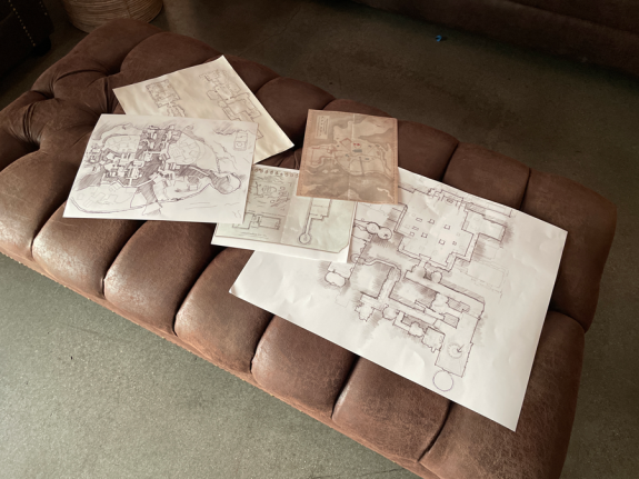 Display of printed in-game maps at the Indiana Jones and the Great Circle Preview Event 