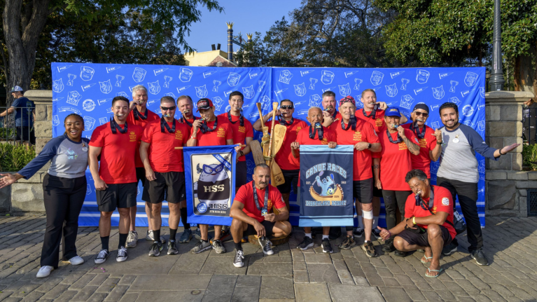 Hank smiles with his winning team at the 2024 Disneyland Resort Canoe Races 