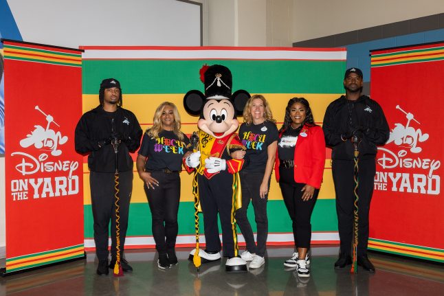 Drum Major Mickey Mouse poses with Disney on the Yard members