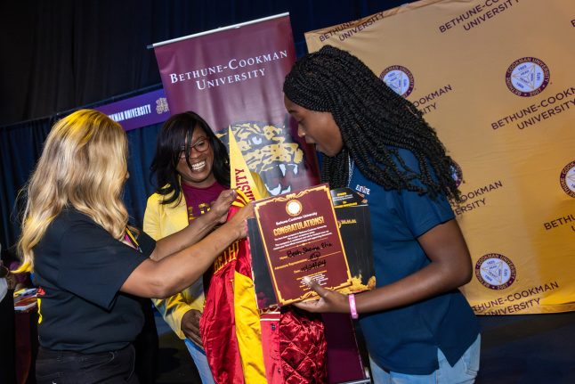 Beth Elia receives her scholarship at the HBCU Week Foundation College Fair