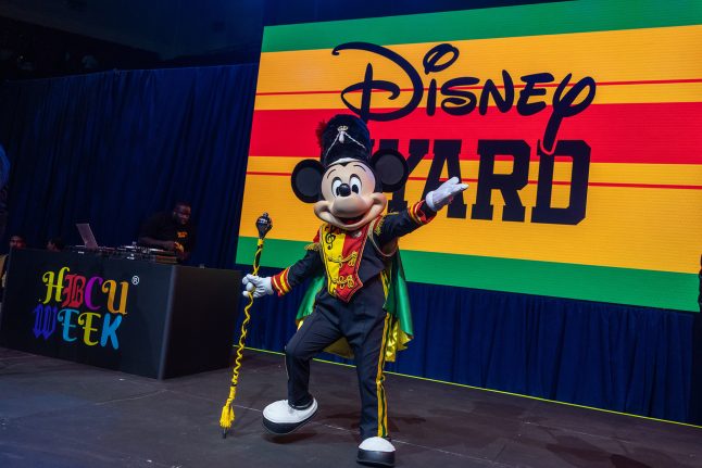 Drum Major Mickey Mouse performs on stage