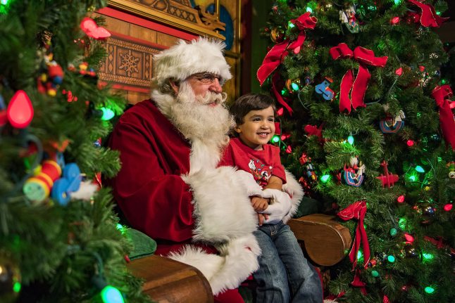 Santa Claus meets a guest at Walt Disney World