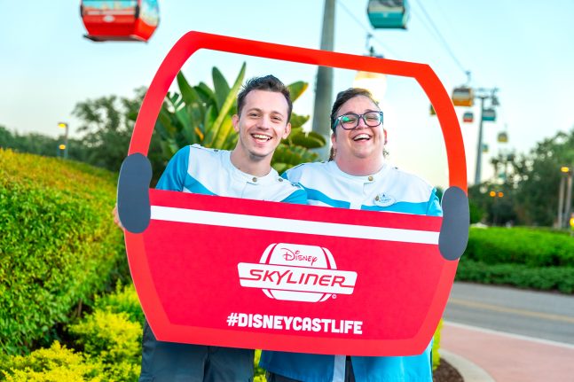 Skyliner cast members smile together