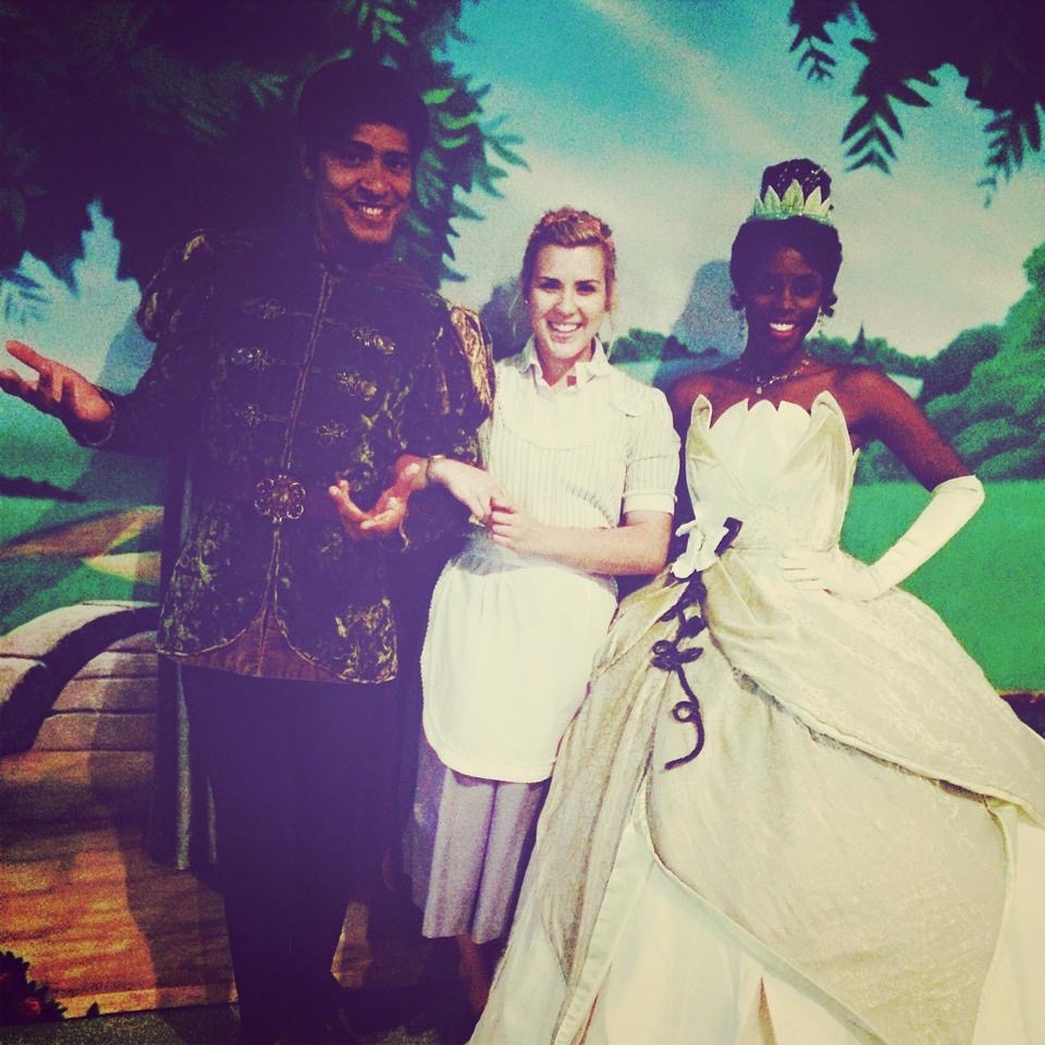 Ashton when she worked in Housekeeping, posing with Princess Tiana and Prince Naveen, 2014.