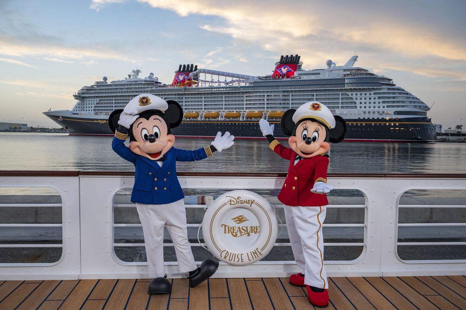 Mickey and Minnie pose with the Disney Treasure at Port Canaveral