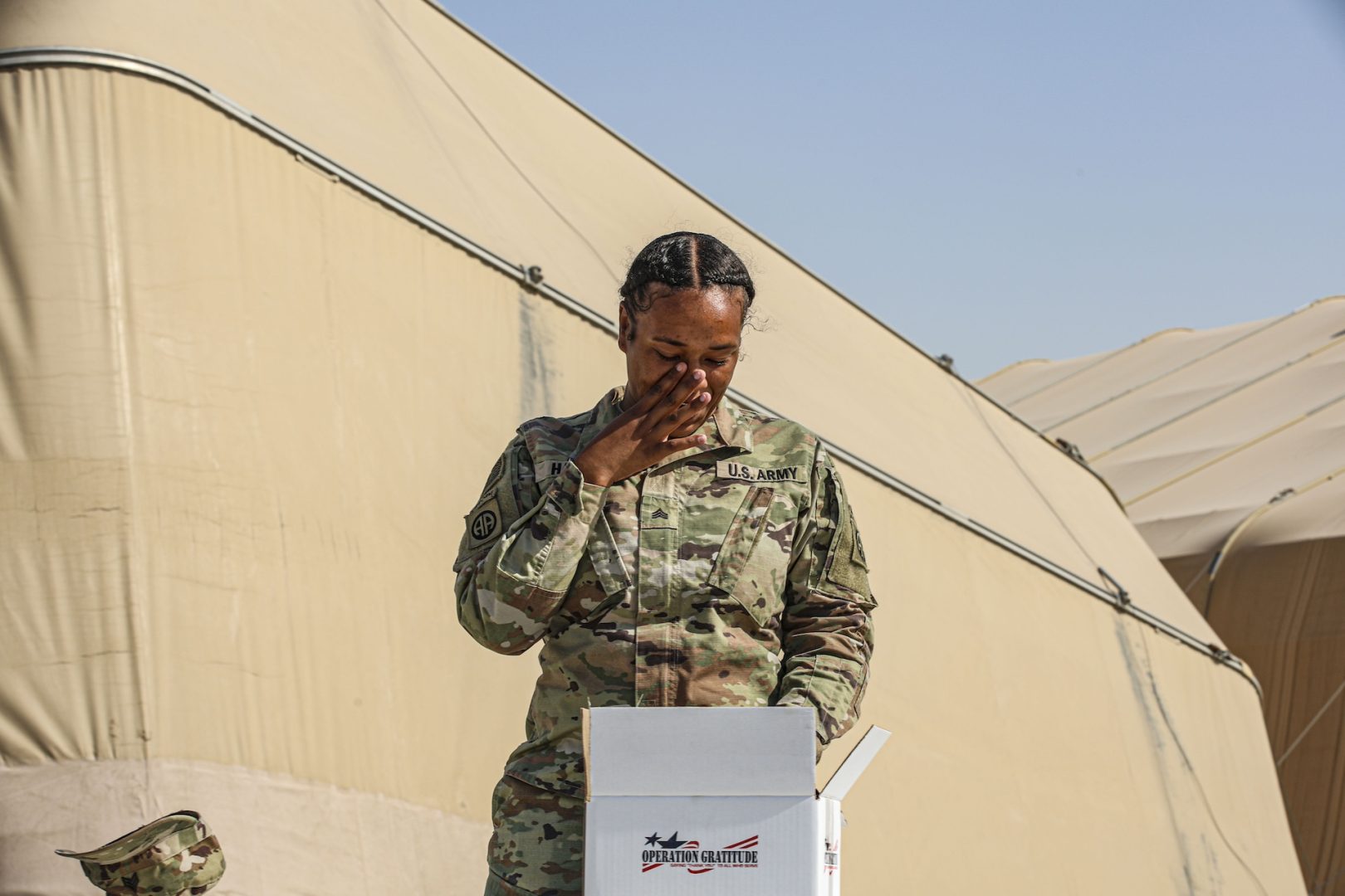 U.S. Army Sgt. Lamari Harris moved to tears after opening the 4 millionth Operation Gratitude care package to Southwest Asia on June 8, 2024, after serving months in the region while deployed with the 82nd Airborne Division. (Photo Credit: SSG Catessa Palone & SGT Vincent Levelev – 82nd CAB Public Affairs)