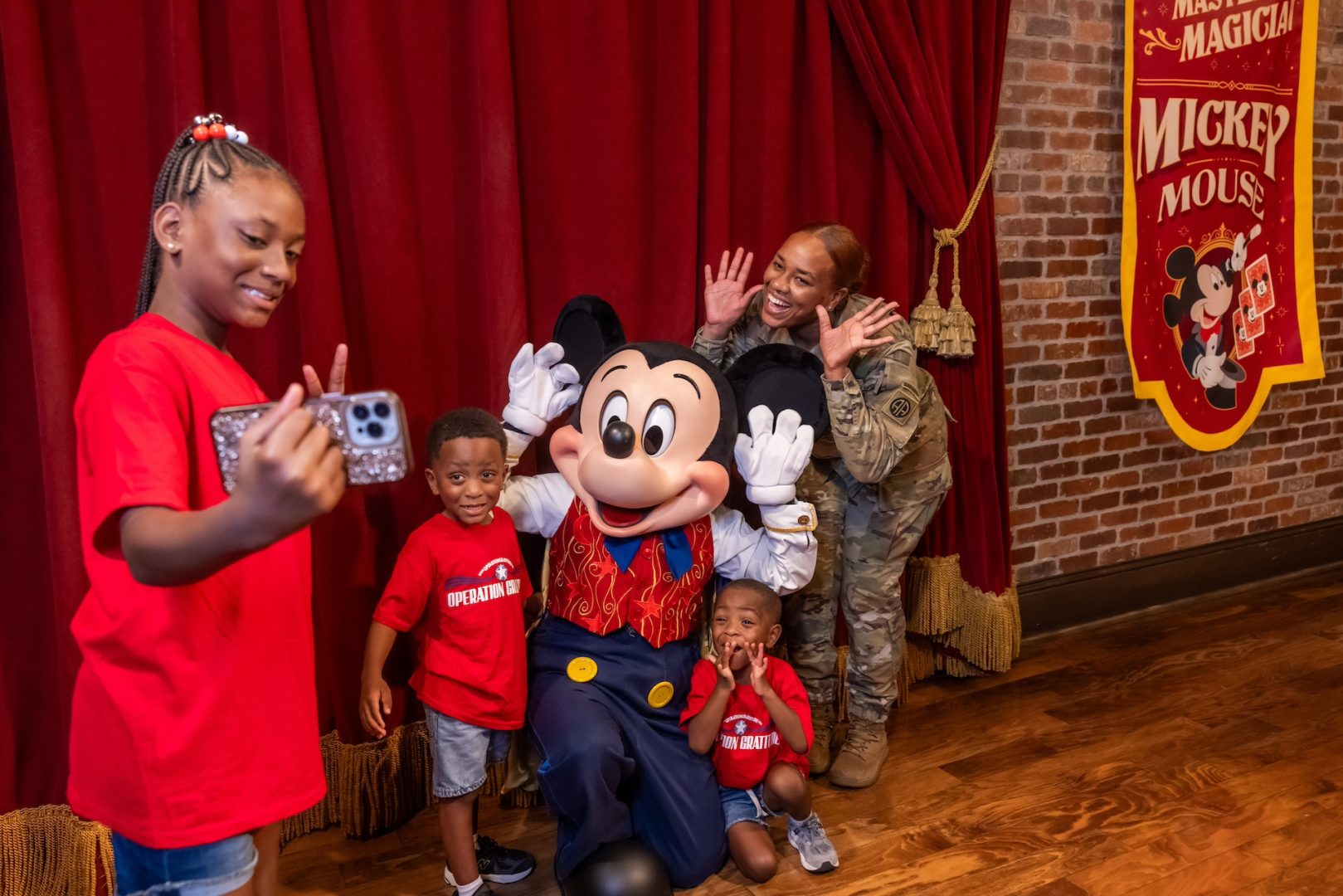 Sgt. Harris and her children meeting Mickey Mouse at The Town Square Theater in Magic Kingdom Park at Walt Disney World Resort on November 12, 2024 (Photo Credit: Disney Parks)